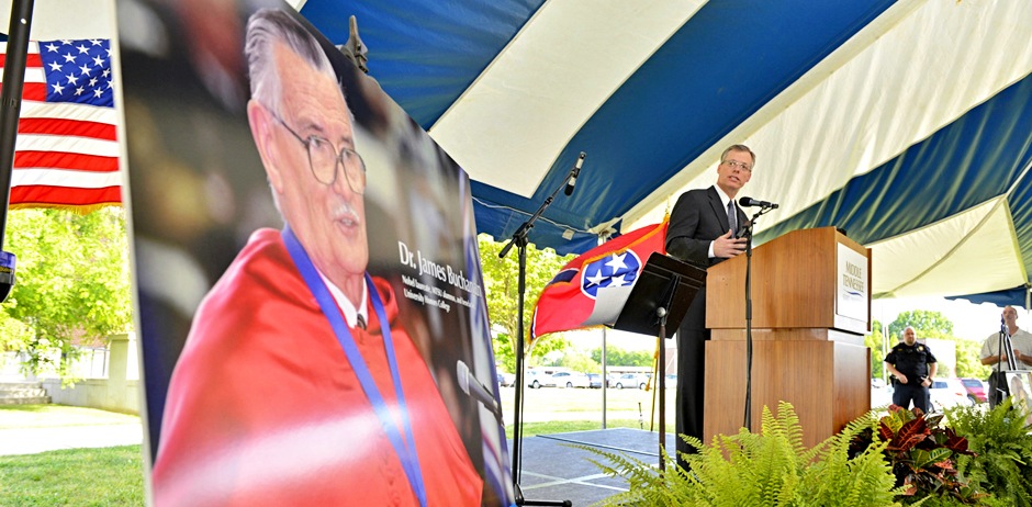 Jeff Whorley glances at a photo of his late uncle, Nobel laureate and MTSU alumnus James M. Buchanan, during a May 9, 2013, special celebration of Buchanan’s life outside the Paul W. Martin Sr. Honors Building. Whorley announced the Buchanan estate's $2.5 million gift to the university. (MTSU file photo by J. Intintoli)