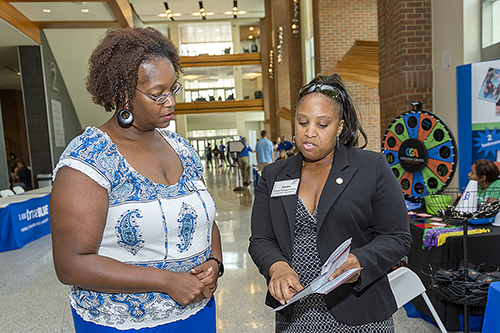 Nneka Norman-Gordon, right, the state’s Higher Education Resource Officer, chats with Cynthia Stone, left, director of MTSU’s Student Union, during an Aug. 6 visit to campus. (MTSU photo by J. Intintoli)