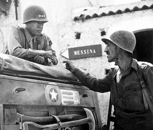 Lt. Col. Lyle Bernard, right, commanding officer of the U.S. Army's 30th Infantry Regiment and a prominent figure in the second daring amphibious landing behind enemy lines on Sicily’s north coast, discusses military strategy with Lt. Gen. George S. Patton near Brolo, Sicily, in 1943. MTSU professor Derek Frisby is leading a new World War II-focused study-abroad excursion to Italy and Sicily this summer. (Photo courtesy of the National Archives and Records Administration/Army Signal Corps)