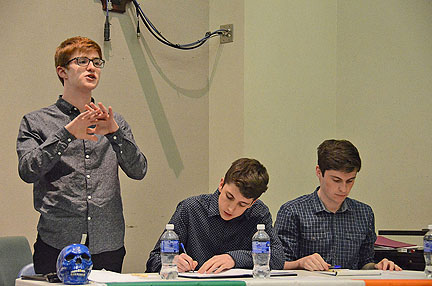 Eoin MacLachlan of University College Dublin in Ireland, at left, makes a point of rebuttal during an April 1 exhibition debate against three members of the MTSU Debate Team. Taking notes are MacLachlan's teammates, Ronan OÕConnor, center, and Hugh Guidera, both of Trinity College Dublin. The three students who won the 55th annual debate competition sponsored by the Irish Times newspaper.