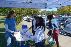 Amanda Sherlin, right, a staffer with the Stormwater Program, signs in students participating in the Oct. 19 campus cleanup event coordinated by the MTSU Stormwater Program. (MTSU photo by Jimmy Hart)