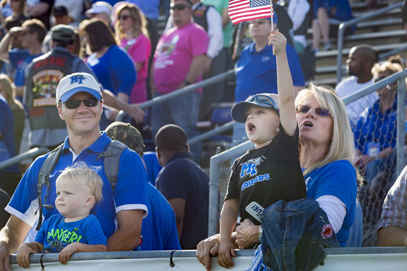 A young Blue Raider fan waves the American flag as military veterans and active duty members take the field at halftime of the MTSU vs. University of Texas-San Antonio game Saturday, Nov. 5, as part of the MTSU Salute to Veterans and Armed Services. (MTSU photo by Kimi Conro)
