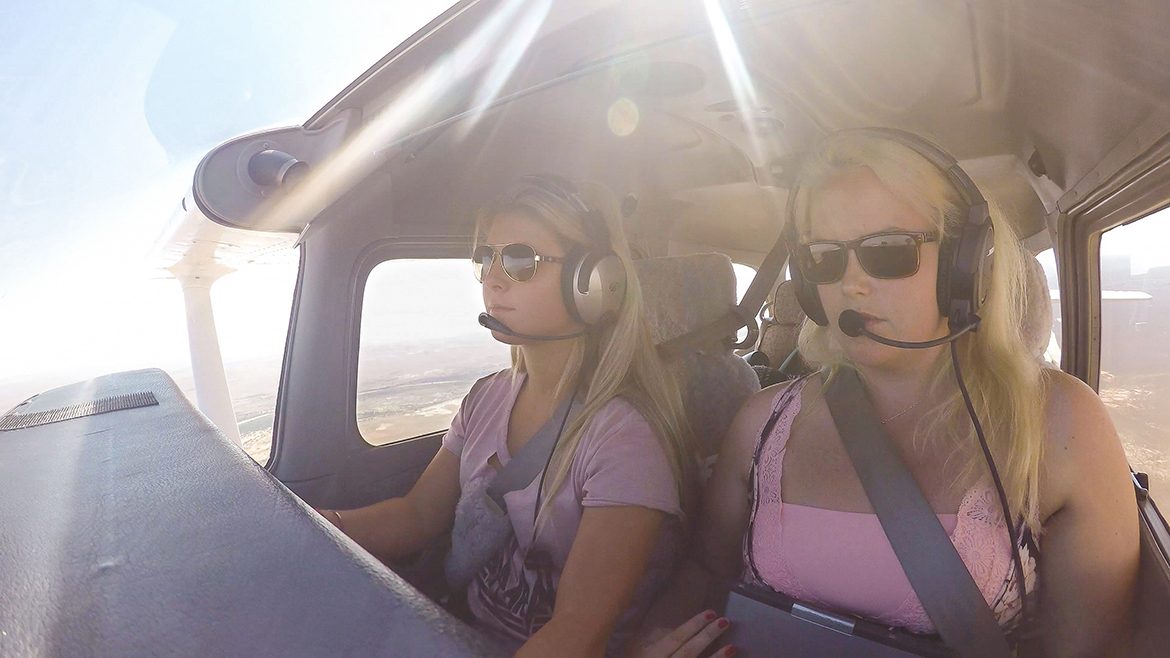 MTSU students Gabriella Lindskoug and pilot Jordan Cantrell fly Air Race Classic plane.