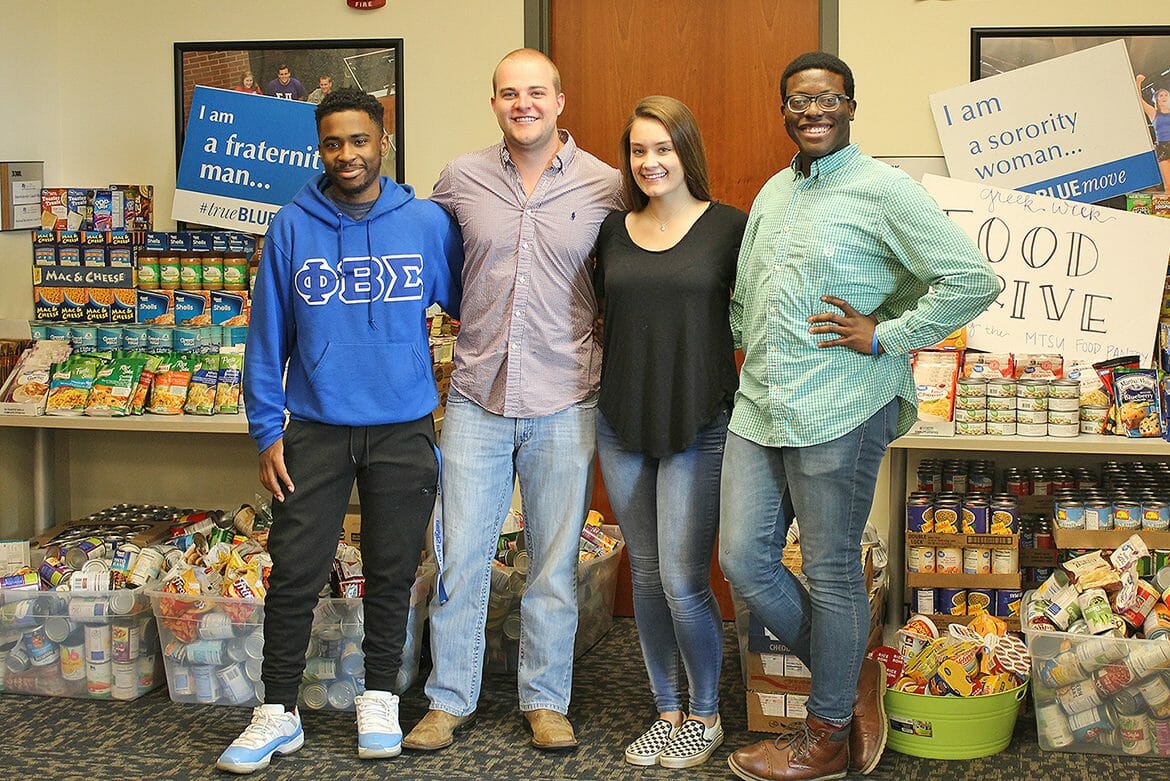 Some of the Greek Week committee members stand in front of the donations collected during MTSU Fraternity and Sorority Life’s Greek Week food drive to benefit the MTSU Student Food Pantry. Pictured, from left, outside FSL’s Student Union offices are MTSU sophomore Deshaun Covington, vice president of Phi Beta Sigma fraternity; senior Ramsey Ferguson, president of Alpha Tau Omega fraternity; junior Alex Revor of Chi Omega sorority; and senior Christian Nevils of Phi Kappa Tau fraternity. (Submitted photo)