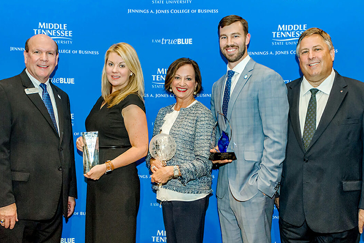 Recipients of the 2018 Business Awards from MTSU's Jones College of Business pause for a photo with Dean David Urban, left, during a Sept. 27 reception at the Embassy Suites in Murfreesboro. Honorees with Urban are, from left, Angie Grissom, owner and president of The Rainmaker Companies, Jones College Exemplar Award winner; Deborah Thompson, State Farm vice president, agency sales, for the southeastern market area, winner of the Jennings A. Jones Champion of Free Enterprise Award; Brian Walsh, Cunningham Financial Group, Young Professional of the Year Award winner; and event sponsor Bob Gerard of First Tennessee Bank. Not pictured is Murfreesboro Mayor Shane McFarland, owner of Shane McFarland Construction and the recipient of the college's Joe M. Rodgers Spirit of America Award winner. (MTSU photo by James Cessna)