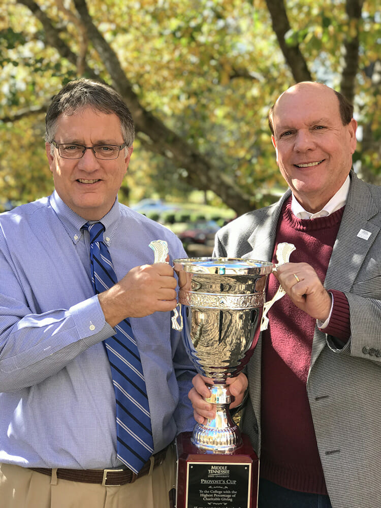 MTSU Provost Mark Byrnes, left, presents Dr. David Urban, dean of the Jennings A. Jones College of Business, with the Provost Cup, the sixth straight year the Jones College has earned this honor for having the highest percentage of participation in the employee Charitable Giving Campaign. (MTSU photo by Allison McGoffin)
