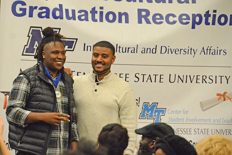 Daniel Green, right, director of the Office of Intercultural and Diversity Affairs, poses with graduating senior BryTavious Chambers during the 2018 Intercultural Graduation Reception held Nov. 19 inside the Student Union Ballroom. Chambers, an integrated studies major, is a top-selling music producer and songwriter known professionally as Tay Keith. (MTSU photo by Jimmy Hart)