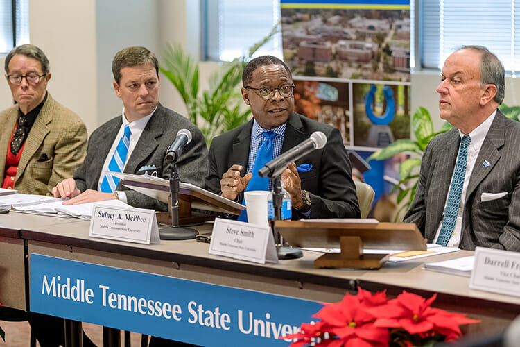 MTSU President Sidney A. McPhee, center right, updates the university’s Board of Trustees Tuesday, Dec. 11, during the board’s quarterly meeting inside the Miller Education Center on Bell Street. At far right is board Chairman Steve Smith. At far left is Trustee Andy Adams seated next to Trustee Pete DeLay. The board approved a five-year contract for McPhee. (MTSU photo by J. Intintoli)