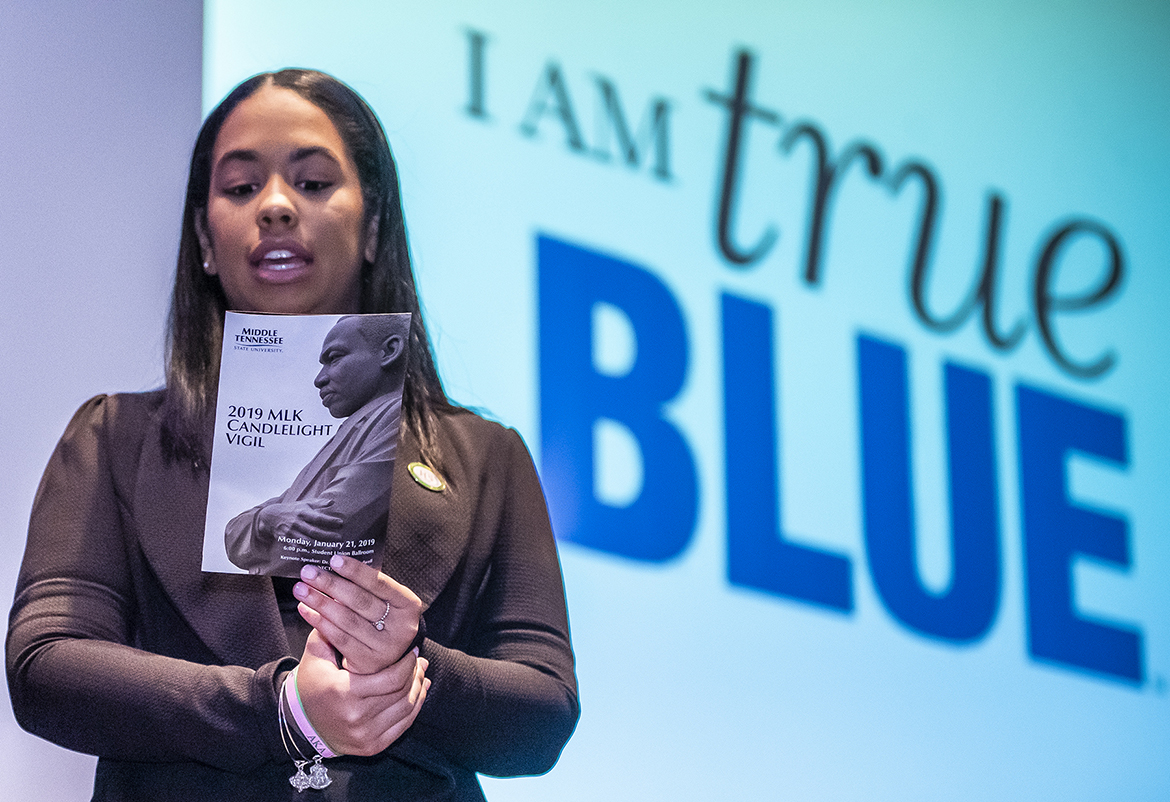 Alpha Kappa Alpha sorority member Cherilynn Mella, chapter vice president and co-emcee of MTSU’s 2019 MLK Candlelight Vigil, recites the True Blue Pledge at the conclusion of the Jan. 21 event inside the Student Union Ballroom. (MTSU photo by Eric Sutton)