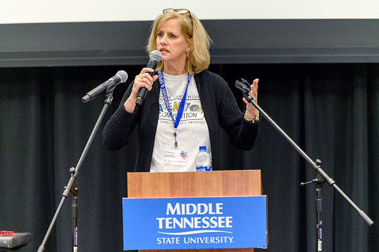 MTSU elementary education professor Tracey Huddleston announces the winners of the 27th annual Invention Convention, held Feb. 21 in the university's Student Union Ballroom. Nearly 800 Midstate youngsters attended this year's event, displaying a total of 375 inventions. Huddleston established the creative opportunity for area fourth-, fifth- and sixth-graders in tribute to her mother, True Radcliff, a longtime fifth-grade teacher who conducted "Invention Convention"-type events at her own school. (MTSU photo by J. Intintoli)