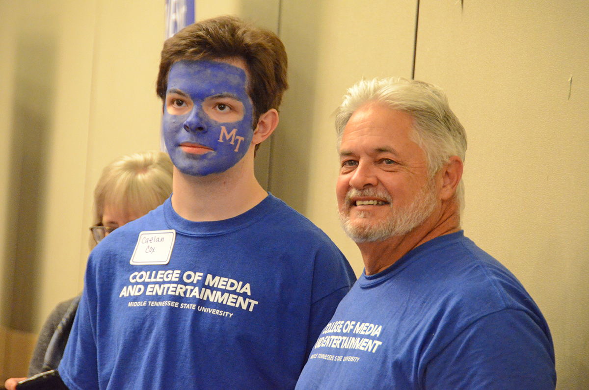With his face painted blue, Caelan Cox attends True Blue Tour in Chattanooga with his father, David Cox.