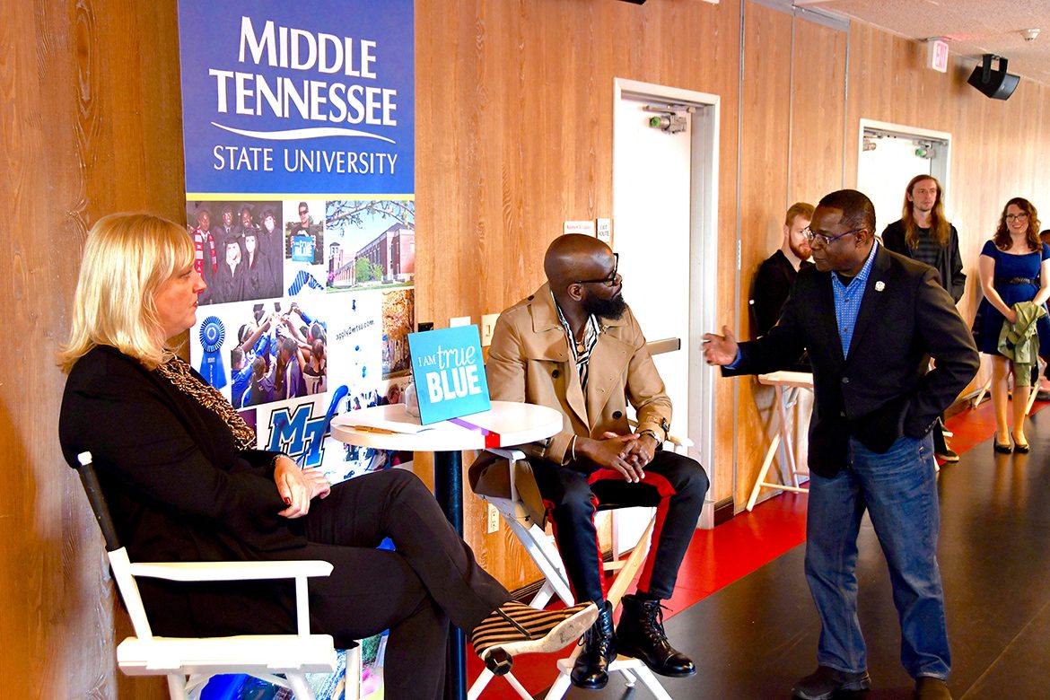 President Sidney A. McPhee, right, congratulates MTSU alumnus and Grammy winner Torrance “Street Symphony” Esmond, who was honored Saturday, Feb. 9, by Middle Tennessee State University as part of its events before the Grammy Awards. At left is Beverly Keel, chair of the Department of Recording Industry. (MTSU photo by Andrew Oppmann)
