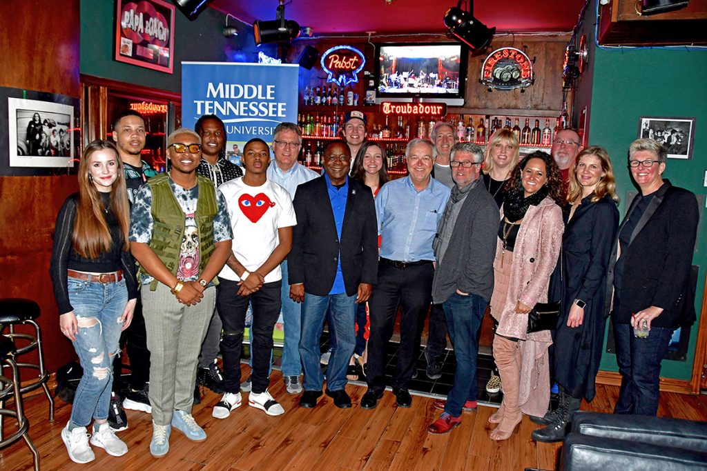 Recent MTSU graduate and rising hip-hop music producer BryTavious “Tay Keith” Chambers, fourth from left, joins students and faculty from the MTSU College of Media and Entertainment at a reception Saturday night, Feb. 9, at the renowned Troubadour music venue. MTSU co-sponsored a tribute by the Americana Music Association of legendary artist John Prine. (MTSU photo by Andrew Oppmann)