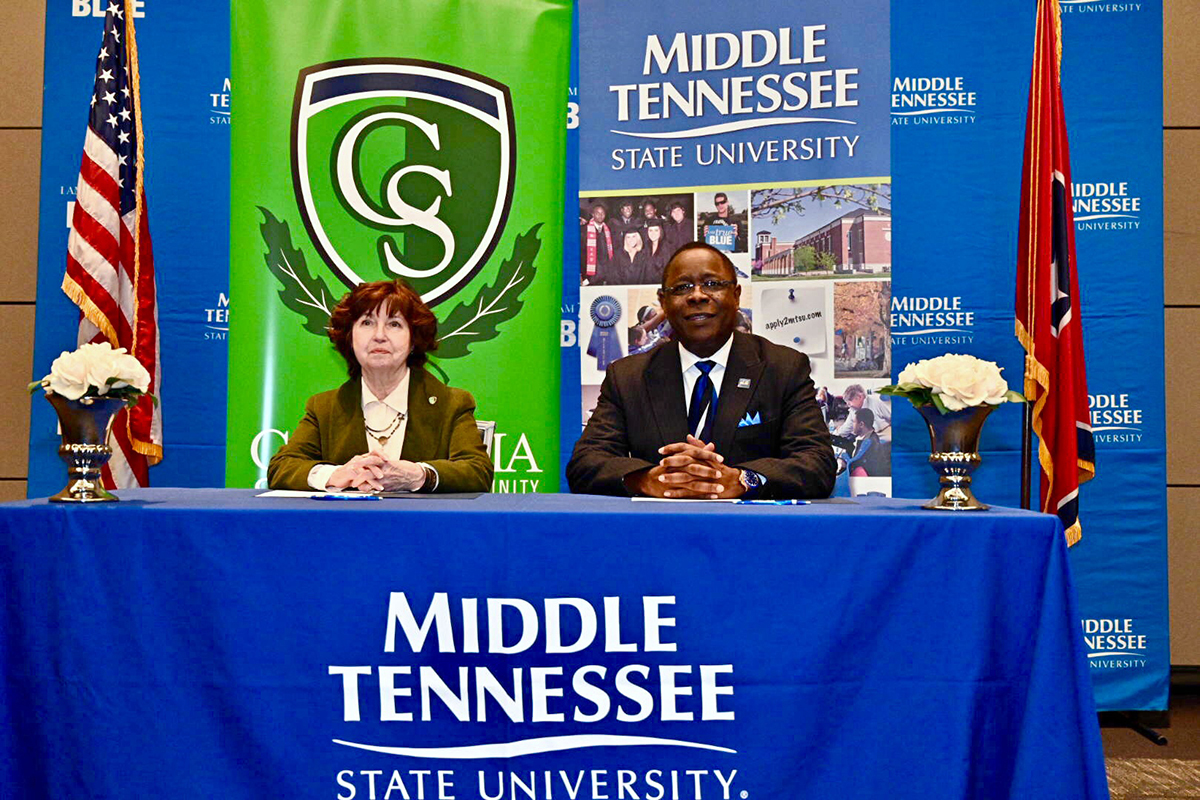 Presidents Janet Smith, left, of Columbia State Community College and Sidney A. McPhee of Middle Tennessee State University talk to the audience before signing an agreement marking the MTSU Promise to Columbia State, the fifth such pathway established for students with associate degrees to move seamlessly to the four-year university. The signing occurred Feb. 6 in the MTSU Student Union Ballroom. (MTSU photo by J. Intintoli) 