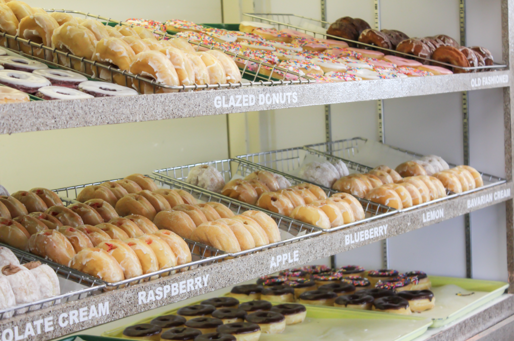 Donuts lined up at counter of Donut Country