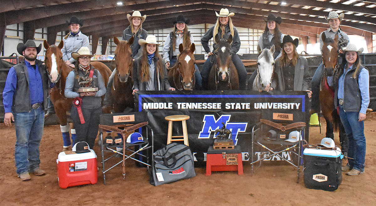 Nine MTSU riders helped capture the American Stock Horse Association Collegiate and National Show Division II championship earlier in April. Team members include, from left, graduate assistant Lucas Brock, Caroline Blackstone, Jenna Seal, Patricia Wingate, Taylor Meek, Kylie Small, Jennifer Dowd, Mary Wade, Lindsay Gilleland, Hunter Huddleston and coach Andrea Rego. Seal and Huddleston hold first-place awards; the national champion trophy is in front of the MTSU stock horse sign. 