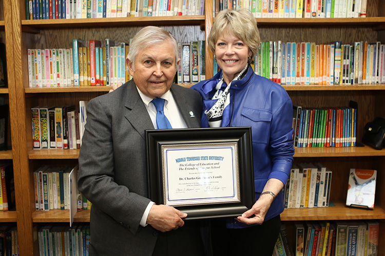 From left, Charles and Delia Goodman hold a special certificate of recognition in honor of their family’s long history of association with Homer Pittard Campus School. The teaching laboratory school owned by MTSU and operated by Rutherford County Schools, held its 90th anniversary celebration Tuesday, April 16, at the school’s East Lytle Street campus. (MTSU photo by James Cessna)