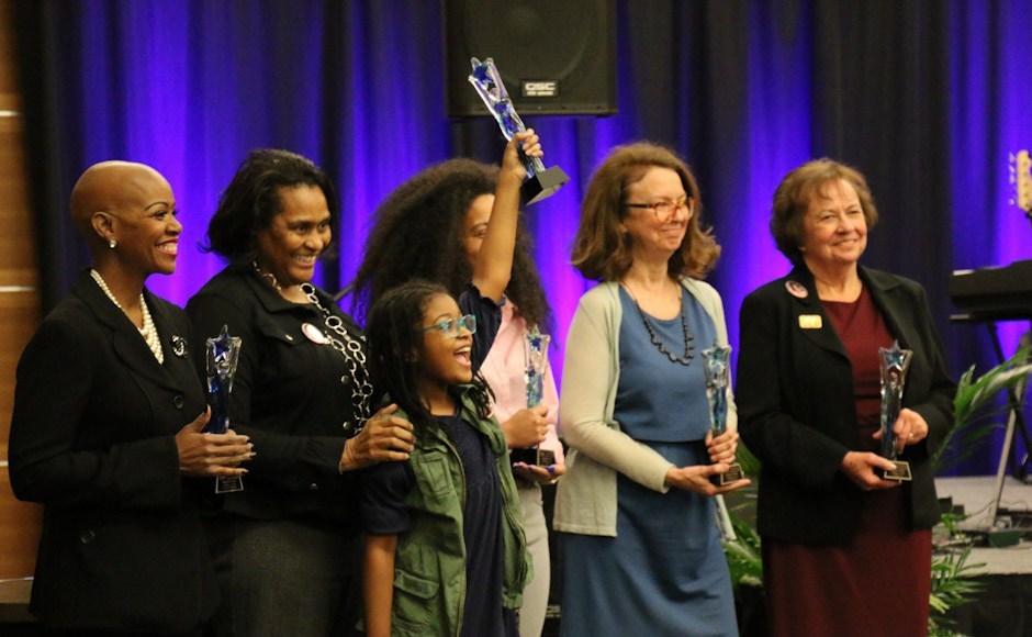Lynda Williams, left, celebrates with her fellow "Trailblazers" honorees during MTSU's 2019 National Women's History Month kickoff ceremony March 12 in the Student Union Ballroom.