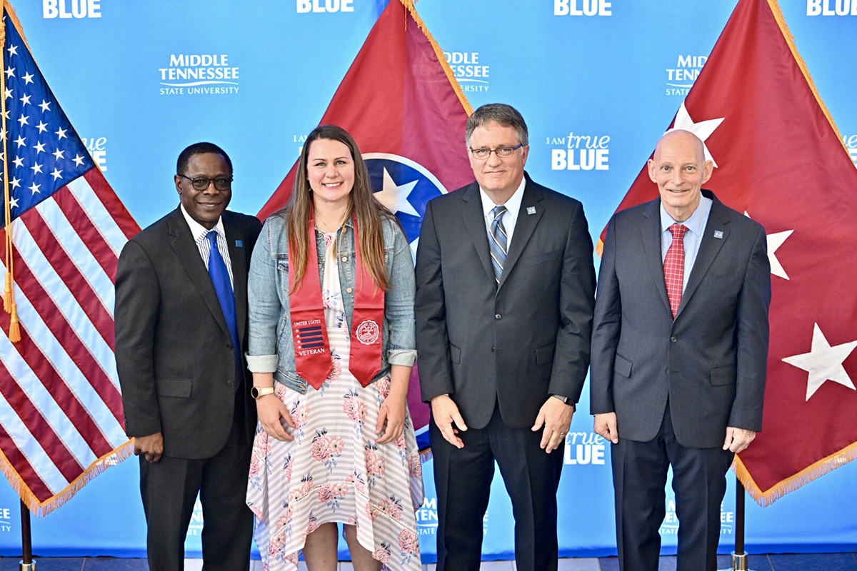 MTSU President Sidney A. McPhee, left, joins graduating veteran Emily Steinway, Provost Mark Byrnes and Keith M. Huber, senior adviser for veterans and leadership initiatives, during the Wednesday, April 24, ceremony at the Miller Education Center. Steinway works full time as the Daniels Center transition manager. 