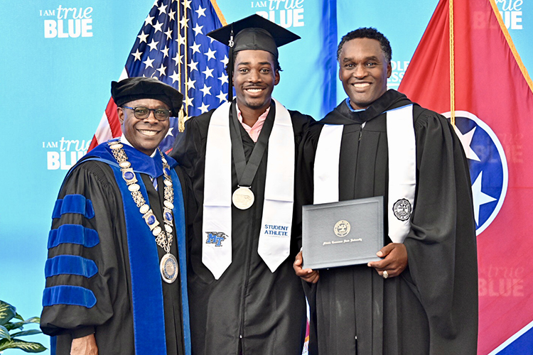 From left, MTSU President Sidney A. McPhee, graduating baseball player Darrell Freeman Jr. and his father and MTSU Board of Trustees Vice Chairman Darrell Freeman Sr. pose for a photo Tuesday, April 23, at a special commencement ceremony for Blue Raider student athletes who have upcoming competition commitments and will be unable to attend the regular May 4 commencement at Murphy Center. The special ceremony was held in the second floor atrium of the Miller Education Center on Bell Street. (MTSU photo by J. Intintoli)