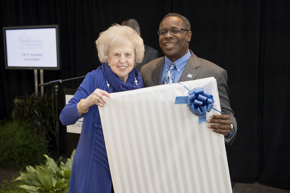 One of MTSU’s most loyal alumni, Dr. Liz Rhea proudly displays hwe “I AM true BLUE” sign during a university Capital Campaign luncheon. The Murfreesboro resident and Eagleville, Tenn., native died Thursday, May 30. (MTSU file photo by Andy Heidt)
