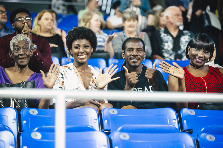 Family members wave to photographers in the crowd at Murphy Center Saturday, May 4, during the first of MTSU’s two spring 2019 undergraduate commencement ceremonies for 2,145 students. Another 384 graduate students received their master’s and doctoral degrees in a May 3 ceremony, bringing the university’s new alumni total to 2,529. (MTSU photo by GradImages)