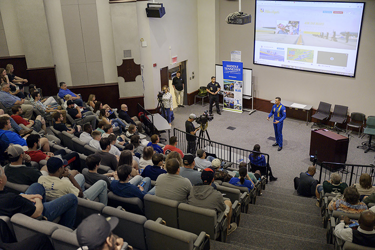 U.S. Marine Corps Maj. Jeff Mullins, a pilot for the U.S. Navy Blue Angels flight demonstration team, gives a presentation before an attentive crowd Friday, June 7, in the State Farm Lecture Hall inside MTSU’s Business and Aerospace Building in advance of the Blue Angels performance this weekend at the Great Tennessee Air Show in Smyrna, Tenn. (MTSU photo by Andy Heidt)