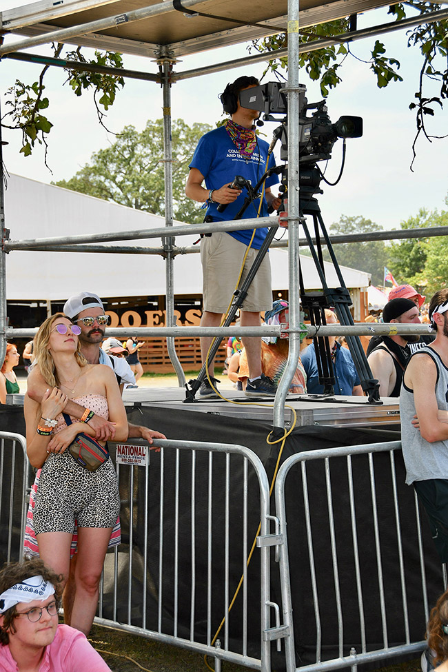 Johanns Frederick Litzenberger-Rivera, a MTSU video production junior, shoots video from a platform Sunday, June 16, at Bonnaroo’s Who Stage in Manchester, Tenn. (MTSU photo by Andrew Oppmann)