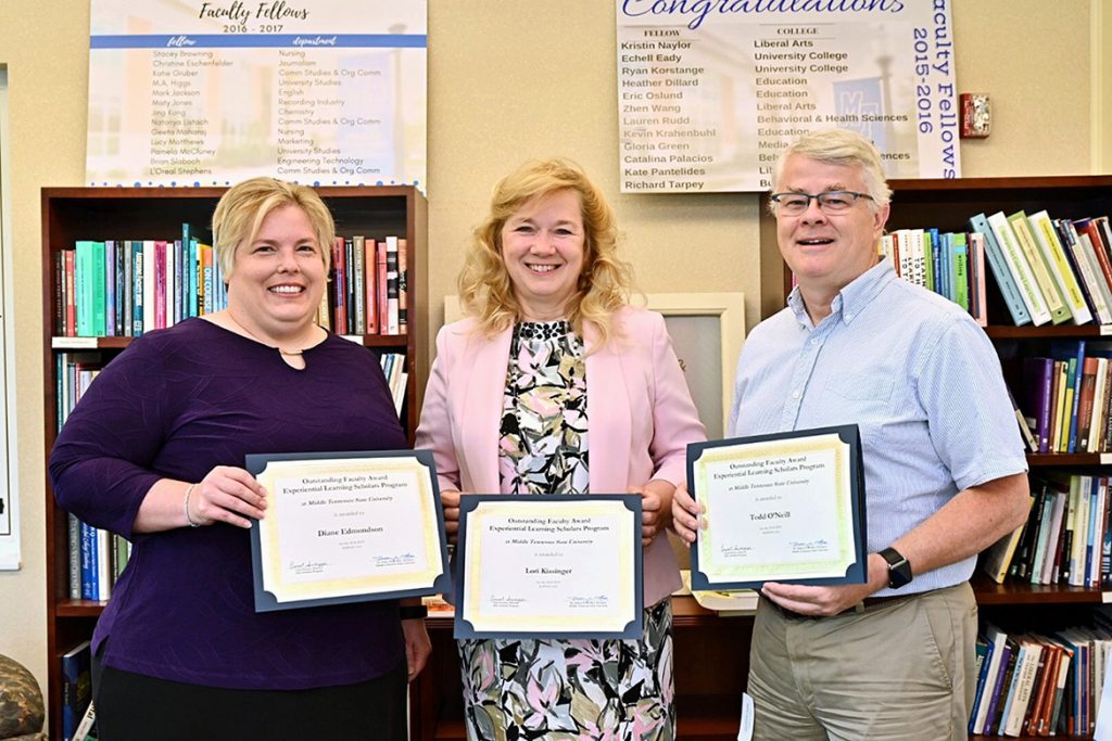 Winners of the 2019 MTSU Outstanding Faculty Awards from the university’s Experiential Learning Program display the honors bestowed upon them June 11 at the EXL Institute in Walker Library. Pictured, from left, are Diane Edmondson, an associate professor of marketing; Lori Kissinger, an instructor of communication studies; and Todd O’Neill, an assistant professor of media arts. Winners Laura Buckner and Jane Lim were not able to attend. (MTSU photo by J. Intintoli)