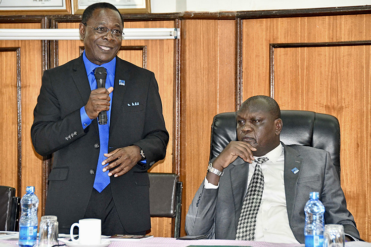 MTSU President Sidney A. McPhee speaks to the Faculty Senate at Moi University in Kenya as Isaac Kosgey, right, Moi’s chief executive officer, listens. (MTSU photo by Andrew Oppmann)