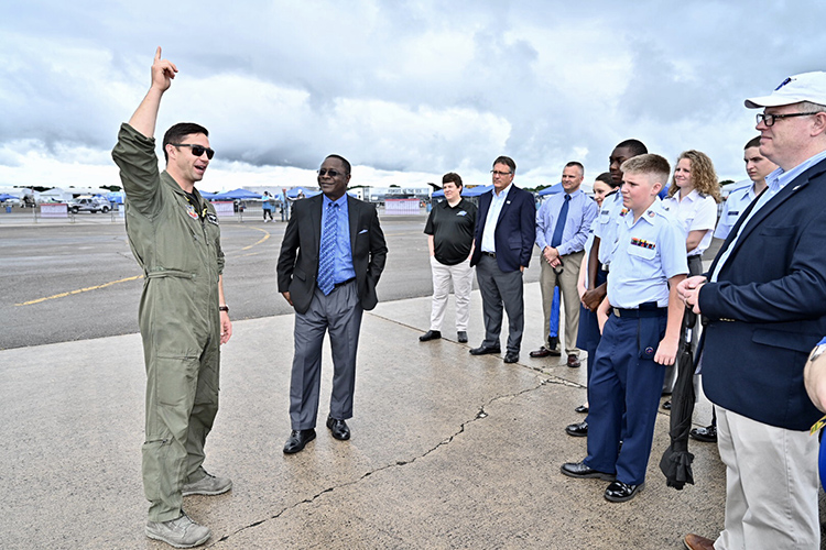 U.S. Air Force Maj. Garret Schmitz, left, commander of the F-16 Viper Demonstration Team, speaks to MTSU President Sidney A. McPhee, second from left, and a university-led contingent visiting Smyrna Airport Friday for the last practice before the scheduled Great Tennessee Air Show this weekend. (MTSU photo by J. Intintoli)