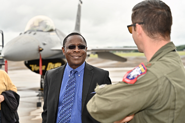 MTSU President Sidney A. McPhee, center, speaks with U.S. Air Force Maj. Garret Schmitz, commander of the F-16 Viper Demonstration Team, at Smyrna Airport Friday for the last practice before the scheduled Great Tennessee Air Show this weekend. (MTSU photo by J. Intintoli)
