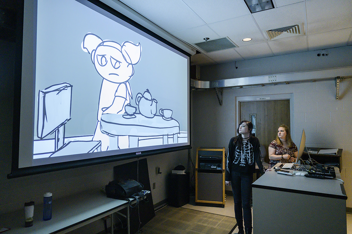 Recent MTSU graduates Ansley Pearson, left, and Catie Adams make a presentation about their senior animation film, “Monstrosi-TEA,” to a group attending the 2019 Alumni Summer College in June. The theme for the 12th annual Alumni Summer College was “That’s Entertainment.” (MTSU photo by Andy Heidt)