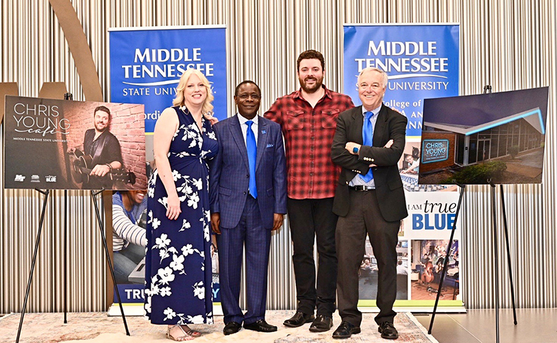 Multi-platinum country artist Chris Young, a former MTSU student, center right, joins President Sidney A. McPhee, center left; College of Media and Entertainment Dean Ken Paulson, right; and Department of Recording Industry Chair Beverly Keel Tuesday, July 9, to announce the Chris Young Café, a live performance venue on the Murfreesboro university’s campus. (MTSU photo by J. Intintoli)