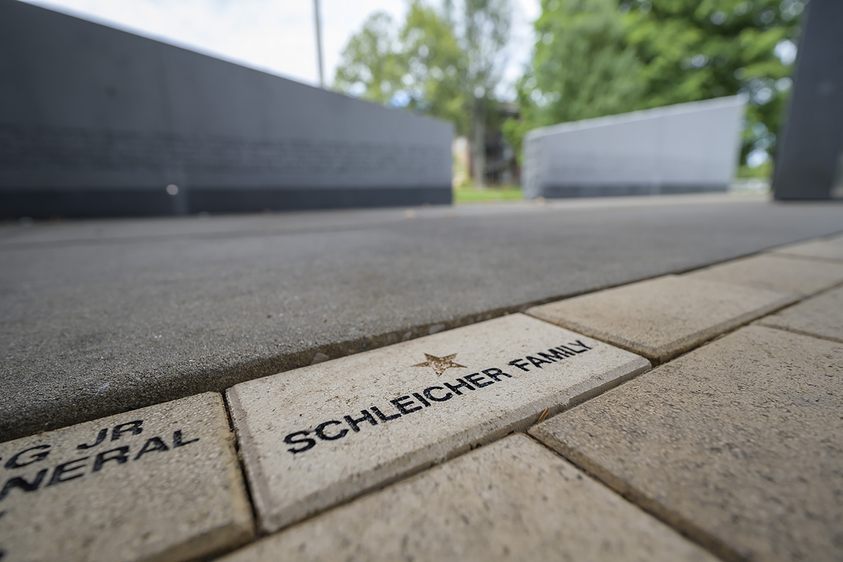 Members of the MTSU Veterans Committee purchased a Gold Star brick to honor the Schleicher family in memory of former student Jimmy Schleicher, a three-sport athlete while attending then-Middle Tennessee State College. Hilary Miller, director of the Daniels Veterans Center, made the preesentation to the family Saturday, July 13, at the Veterans Memorial site. (MTSU photo by Andy Heidt)