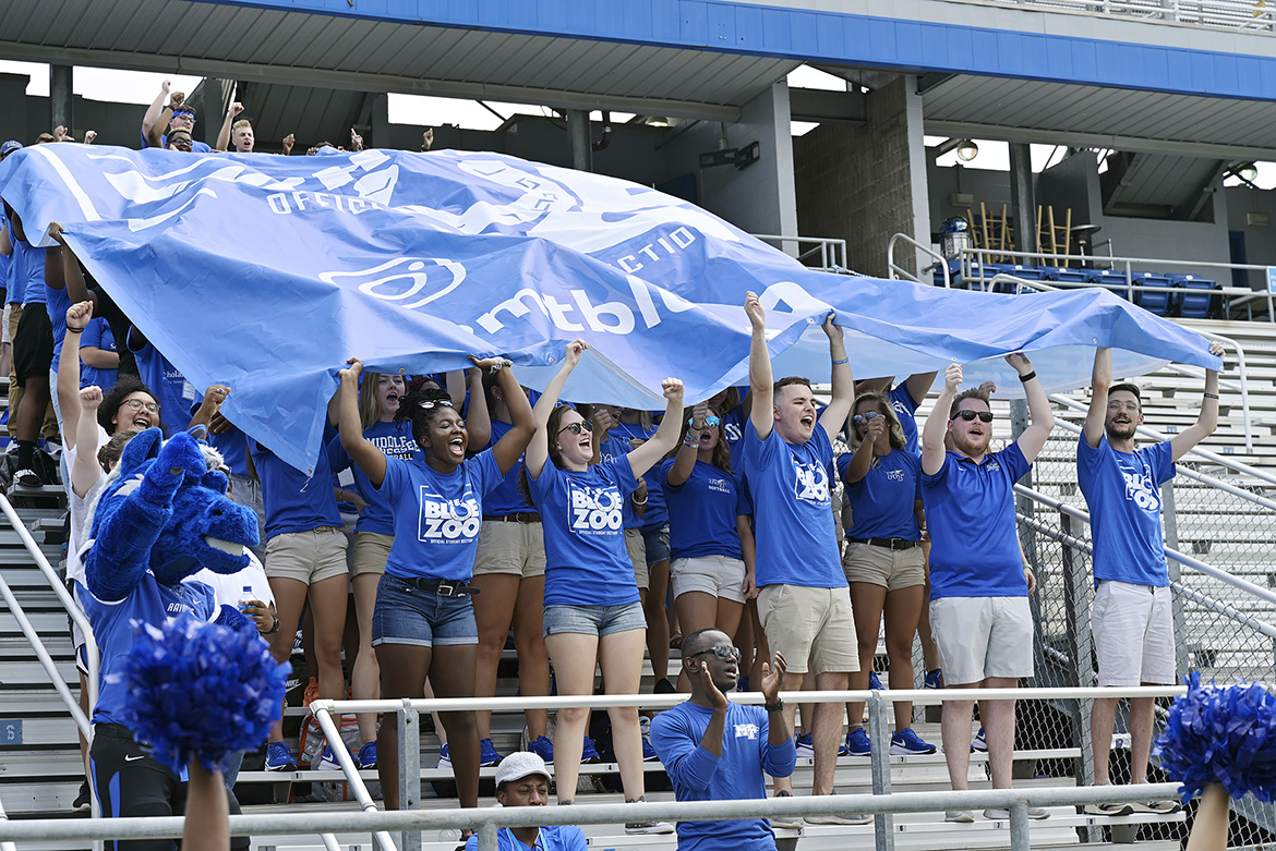 Officers and founders of the Blue Zoo, the newly revived student pep group at MTSU, stand in the first row of more than 300 students holding aloft the organization’s banner for the first time at an event Tuesday, Aug. 13, at Floyd Stadium. (MTSU photo by Andy Heidt)