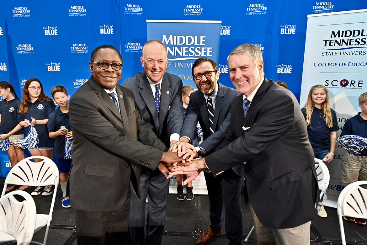 Pictured, from left, are MTSU President Sidney A. McPhee; MTSU Board of Trustees Chairman Stephen Smith; SCORE President and CEO David Mansouri; and former U.S. Senate Majority Leader Bill Frist, SCORE founder and chairman. Middle Tennessee State University and SCORE (State Collaborative on Reforming Education) signed an agreement Wednesday, Aug. 28, that seeks to improve teacher training within the university’s College of Education.. The signing was held at Homer Pittard Campus School, a K-5 teaching laboratory school owned by MTSU and operated by Rutherford County Schools. (MTSU photo by J. Intintoli)