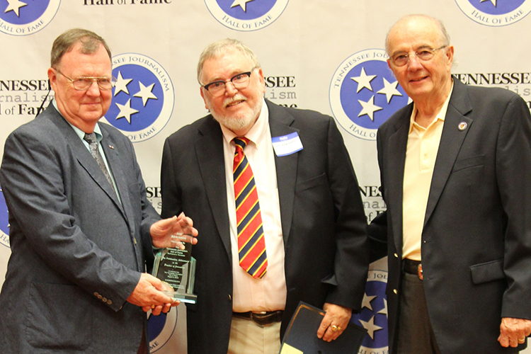 Joe Edwards, center, retired 42-year veteran with The Associated Press in Nashville, Tenn., receives his award and certificate during the induction ceremony for the 2019 class of the Tennessee Journalism Hall of Fame held Tuesday, Aug. 6, at Embassy Suites in Murfreesboro, Tenn. Shown with him are Hooper Penuel, right, TJHOF co-founder and secretary, and TJHOF President Larry Burriss. (Submitted photo)