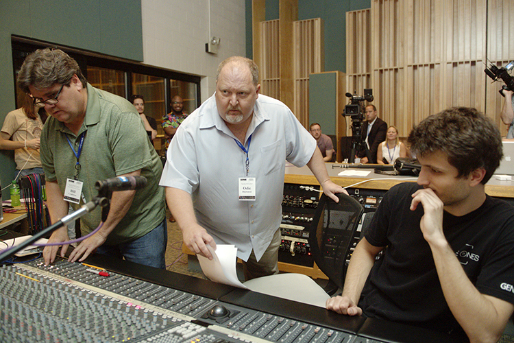 MTSU Commercial Songwriting Program coordinator Odie Blackmon, center, watches a recording engineering demonstration in the College of Media and Entertainment's Studio B during the summer 2018 Association for Popular Music Educators conference on campus. Colleague Bill Crabtree, left, an assistant professor in the Department of Recording Industry who specializes in audio production, adjusts levels on the console while Gleb Iarovoi, right, a graduate student in the Master of Fine Arts in Recording Arts and Technologies Program, listens closely. Blackmon is a member of the newly created U.S. Copyright Office Music Licensing Collective's Dispute Resolution Committee, which is tasked with setting up rules by January 2021 to ensure that songwriters receive proper royalties for digital plays of their music. (MTSU file photo by J. Intintoli)