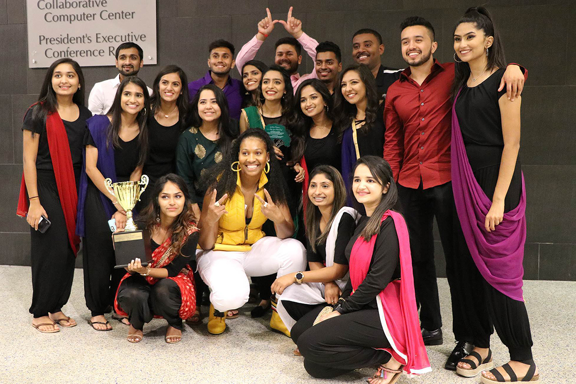 Members of the Indian Cultural Exchange Organization are all smiles as they pose with their first place trophy after winning the 2019 Rep Your Roots talent showcase held Friday, Sept. 20, in the Student Union atrium. (Submitted photo)