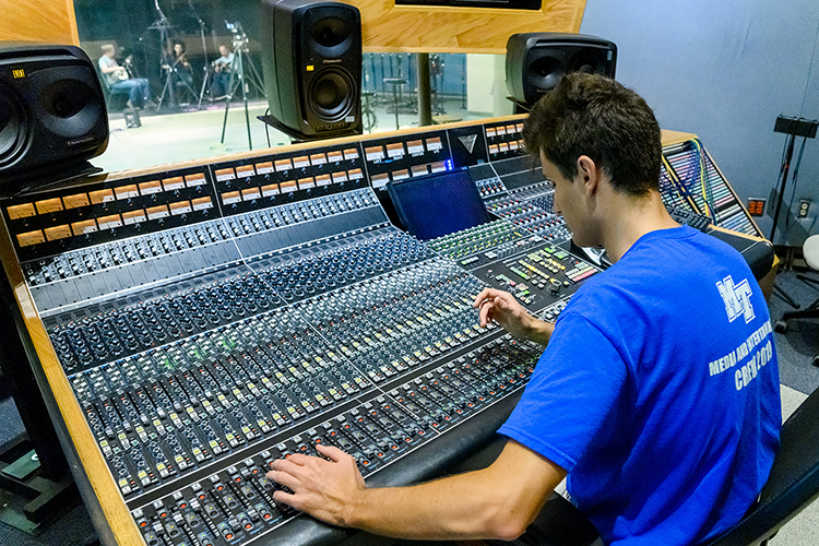 Gleb Iarovoi, an audio engineering graduate student in MTSU's Master of Fine Arts in Recording Technologies program, fine-tunes the mix during a recording session for new MTSU grad Austin Derryberry in the university's Studio A in the Bragg Media and Entertainment Building. MTSU's Center for Popular Music is creating its first CD on campus for its Grammy-winning Spring Fed Records label to capture Derryberry and fellow old-time fiddler Trenton "Tater" Caruthers of Cookeville, Tenn. (MTSU photo by J. Intintoli)