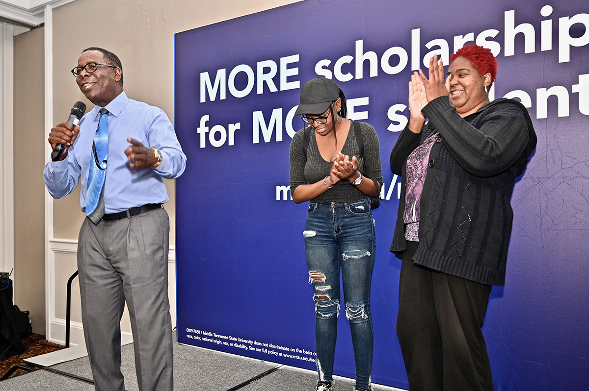 MTSU President Sidney A. McPhee, left, discussed the $6,000 MTSU scholarship just won by Arianna Smith, a senior at Hume-Fogg Academic High School, as her mother, Casius Smith, feels overjoyed. The president awarded a number of scholarships and other prizes to the prospective students. (MTSU photo by Andrew Oppmann)