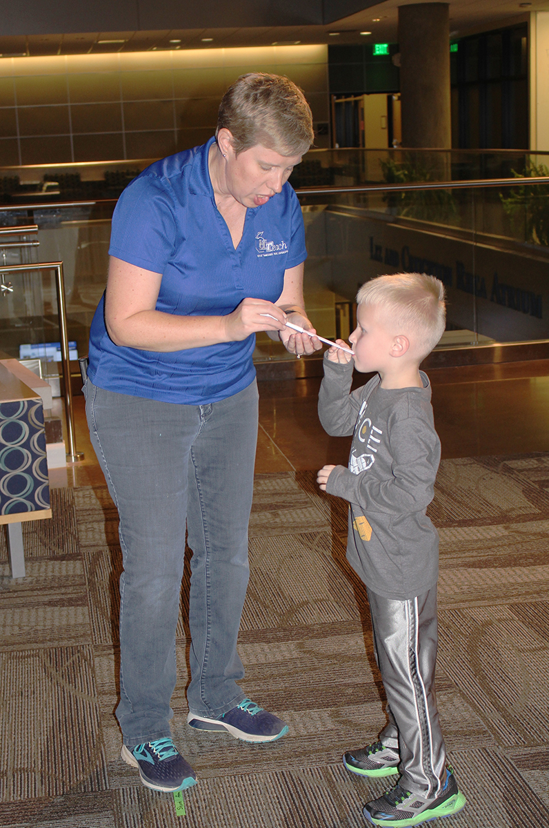 MTSU MTeach program instructor Sally Millsap, left, helps her son, Joe, now 6, launch a paper rocket with a straw during the Tennessee STEAM Festival’s October Sky Family Movie Night in October 2018. This year, the free College of Basic and Applied Sciences and MTeach “Charlotte’s Web” movie and activities will be held from 5:30 to 8 p.m. in the Science Building, 440 Friendship St. (Submitted photo)