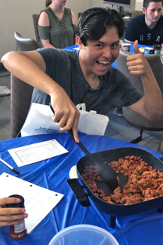 Aaron Musico, an sophomore biology major from Parsons, Tenn., shows his excitement in one of MTSU’s cooking classes under the Project Diabetes initiative. (Submitted photo)