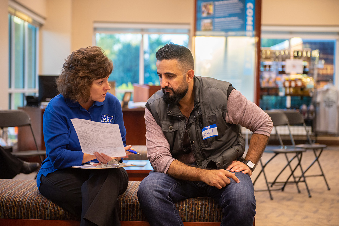 Dianna Rust, a professor in University Studies for MTSU’s University College, talks with a prospective student at the Finish Your Degree Q and A event held Oct. 23 at the Rutherford County Chamber of Commerce in Murfreesboro, Tenn. (MTSU photo by Hunter Patterson)