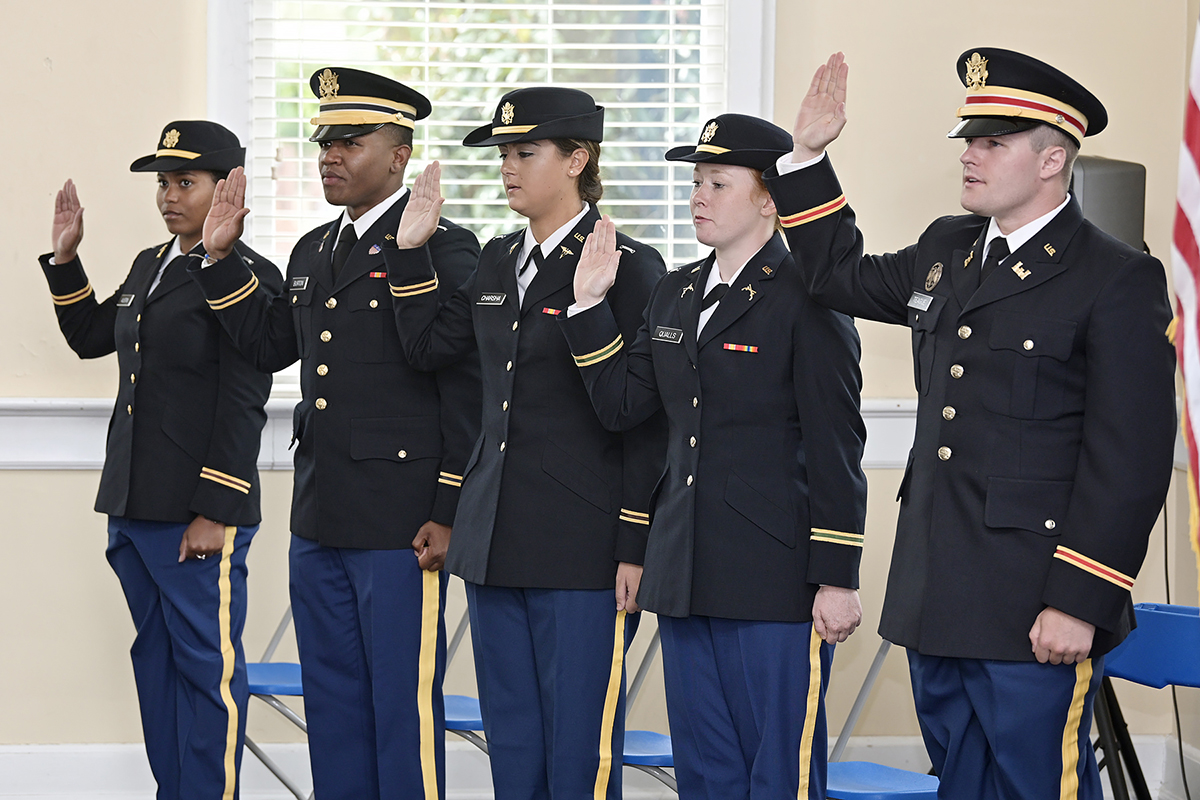 Sierra Austin, left, and Anthony Burton of Murfreesboro, Mekaila Charsha of Maryville, Tenn., Kaitlyn Qualls of Murfreesboro and Bryce Teague of Franklin, Tenn., receive the commissioning oath at the MTSU military science ceremony in the Tom H. Jackson Building’s Cantrell Hall during the summer commissioning ceremony in August. (MTSU photo by Andy Heidt)