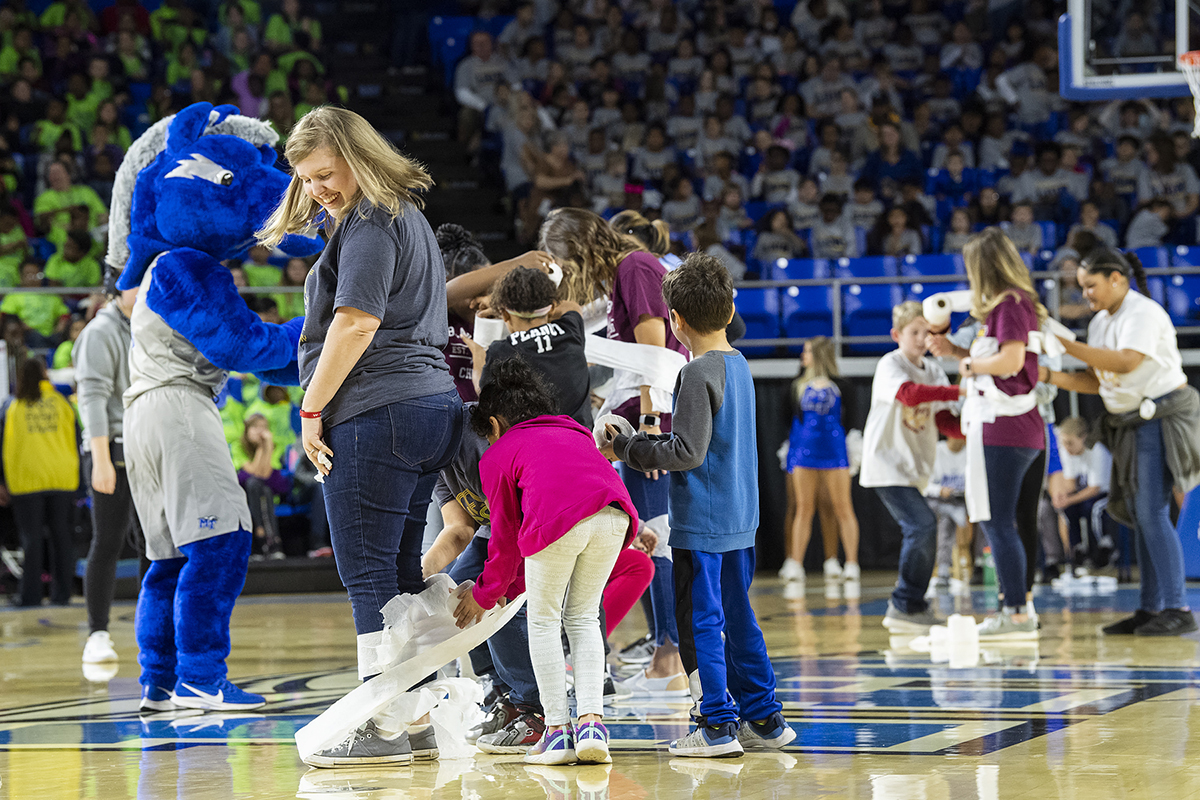 Murfreesboro City Schools’ students participate in the “Mummy Wrap” contest during the annual Education Day basketball game at Murphy Center. The MT Lady Raiders beat visiting Lipscomb University 64-42. (MTSU photo by Andy Heidt)