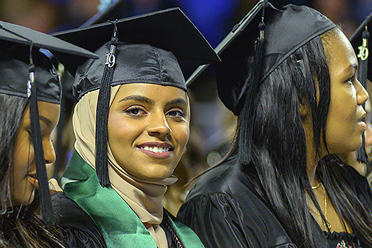 A new MTSU graduate pauses to smile during the celebration at Murphy Center Saturday, Dec. 14 at the university's fall 2019 afternoon commencement event. (MTSU photo by Cat Curtis Murphy)