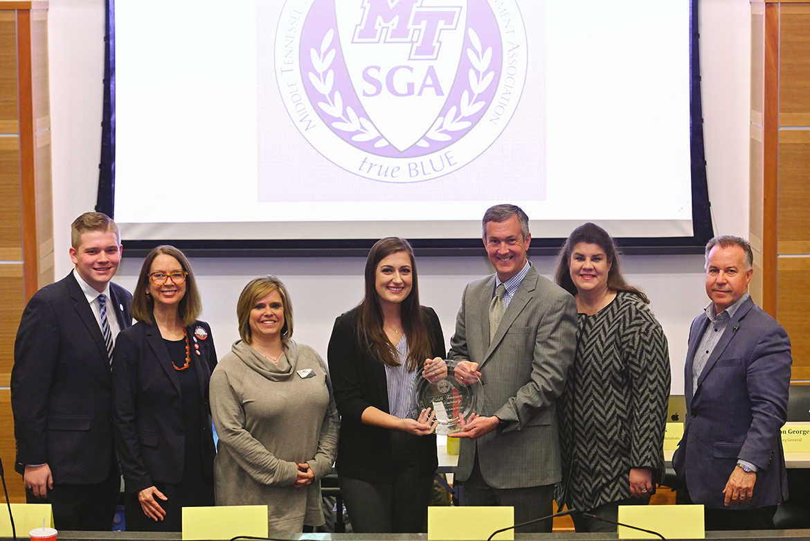 Tennessee Secretary of State Tre Hargett, third from right, presents the 2019 Tennessee College Voter Registration Competition award for the state’s four-year universities to MTSU Student Government Association President Delanie McDonald on Thursday, Feb.12, in the MTSU Student Union Parliamentary Room. Pictured, from left, are MTSU SGA Attorney General Preston George; Mary A. Evins, an associate research professor and coordinator for the MTSU chapter of the American Democracy Project; Jackie Victory, director of student organizations and service in the MTSU Center for Student Involvement and Leadership; McDonald; Hargett; state Sen. Dawn White of Murfreesboro, Tenn.; and state Rep. Mike Sparks of Smyrna, Tenn. (MTSU photo by Cat Curtis Murphy)