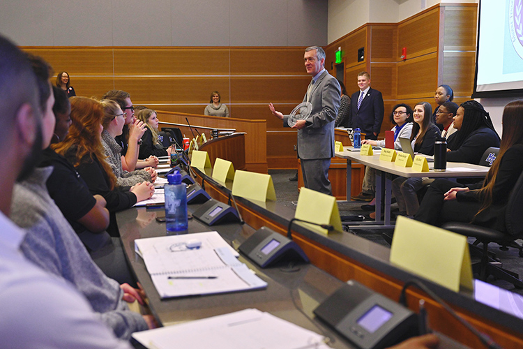 Tennessee Secretary of State Tre Hargett holds the 2019 Tennessee College Voter Registration Competition award for the state’s four-year universities as he speaks to members of the MTSU Student Government Association on Thursday, Feb.12, in the MTSU Student Union Parliamentary Room. Hargett presented the award to SGA President Delanie McDonald and other MTSU representatives. (MTSU photo by Cat Curtis Murphy)